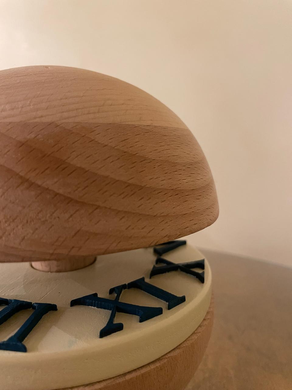 Detail of the Orbit prototype, beech dome and 3D-printed Roman numerals