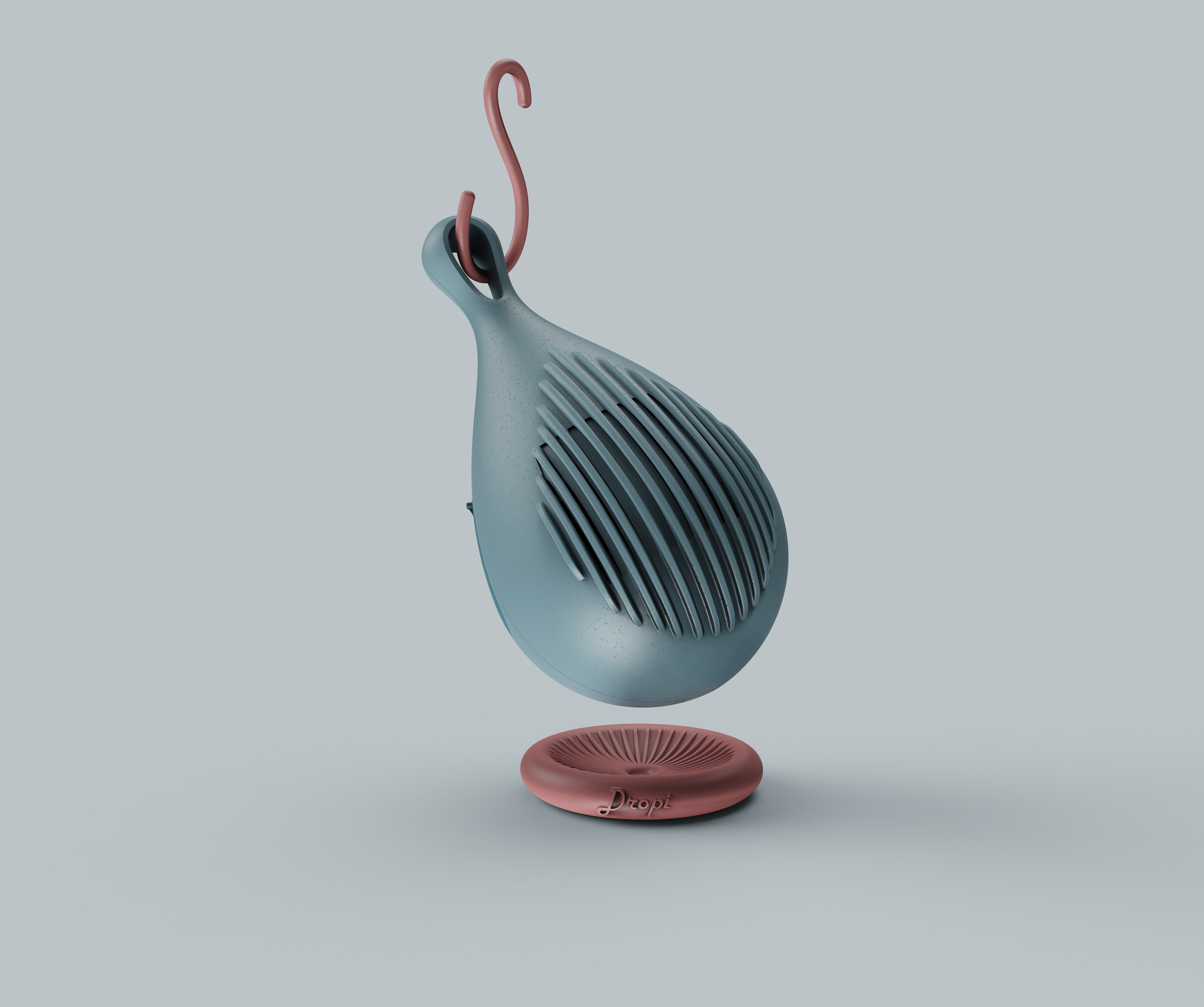 Dropi blue speaker hanging on a pink hook above its matching pink stand